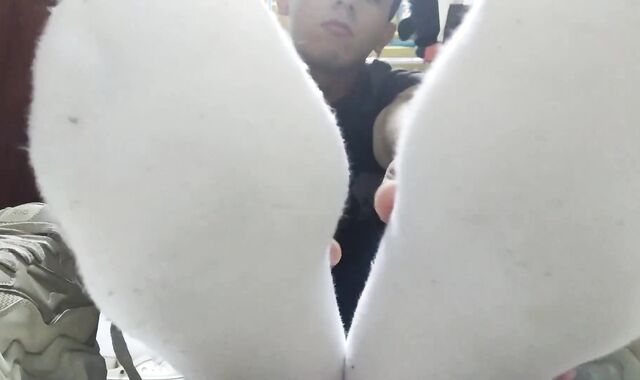 Sweat-Sopping white socks and nude feet after a long day