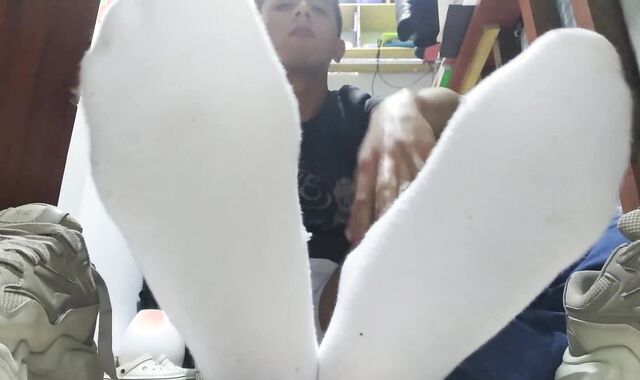 Sweat-Sopping white socks and nude feet after a long day