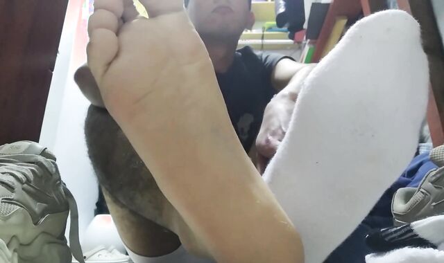 Sweat-Sopping white socks and nude feet after a long day