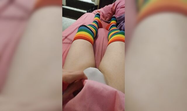 Weak femboy in pink college girl uniform and rainbow gloves & pantyhose blows a load