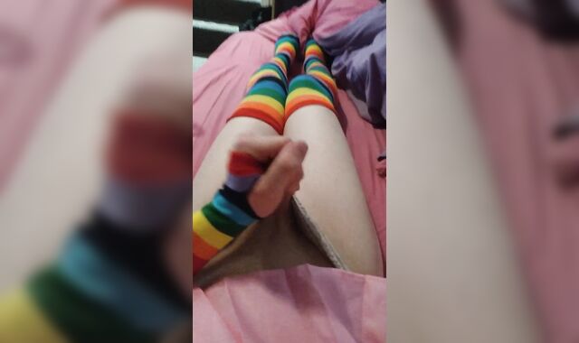 Weak femboy in pink college girl uniform and rainbow gloves & pantyhose blows a load