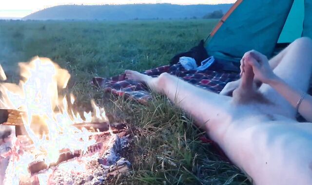 Boy wanks weekly jizm near campfire and tent