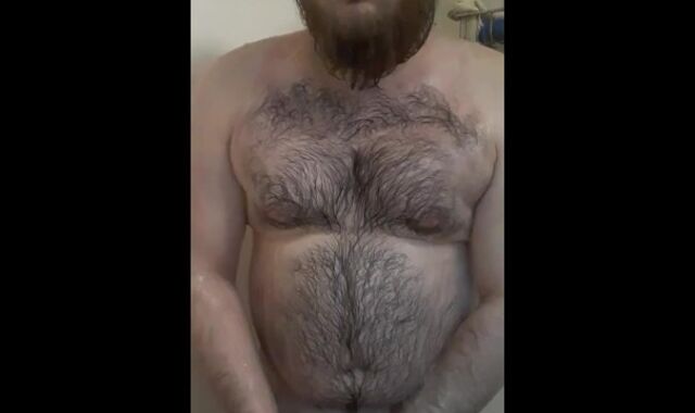 Bearded fellow with daddy body shower getting off