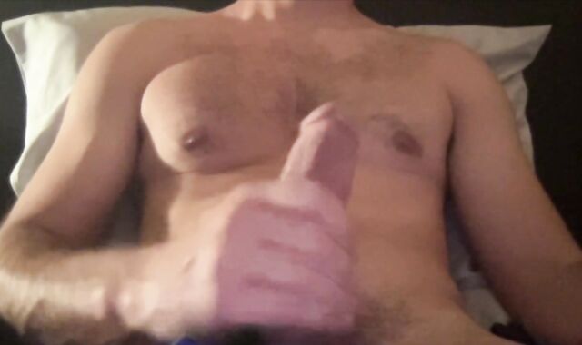 fit boy makes his gigantic pipe spunk while laying in his bed