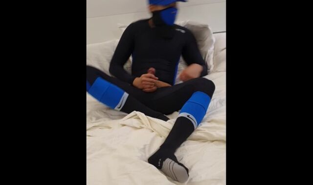 Jerkoff in blue Skins and football socks