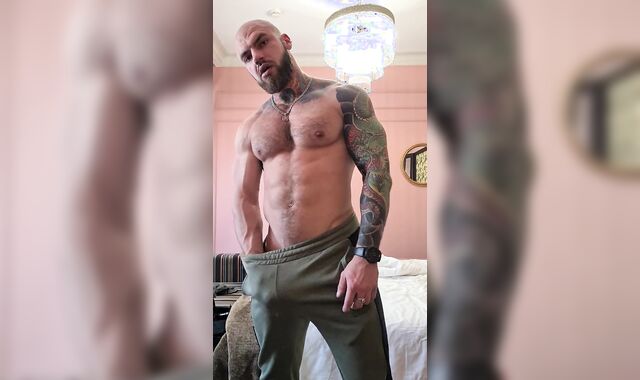 Inked cub flex muscle and stroke man sausage