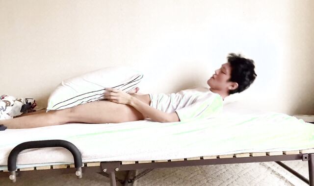 Perverted Asian boys touching their boners on the couch.