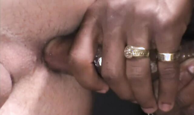 A milky guy and a dark-hued dude deep throating each others rosy cigar