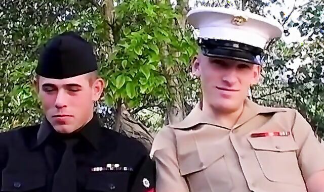 Uniformed army dudes Josh Williams and Matt Woods fellate schlongs