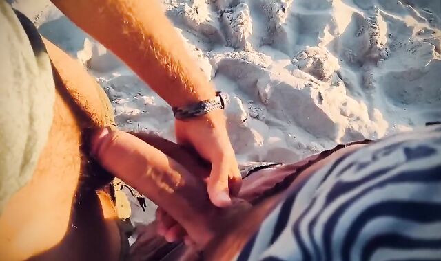 Sword Struggling penises with ample shoots a flow in a paradise beach at sunset