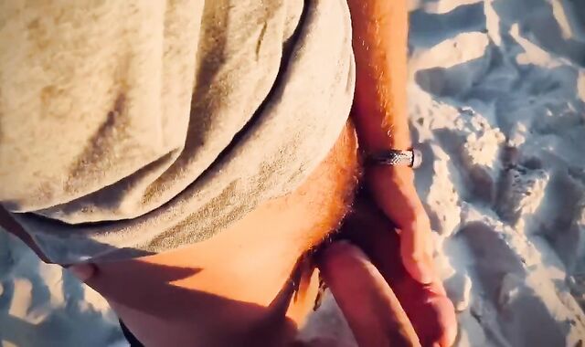 Sword Struggling penises with ample shoots a flow in a paradise beach at sunset