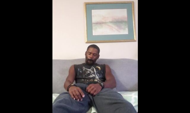 Buck demonstrating off and wanking on the couch