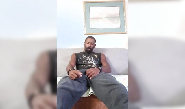 Buck demonstrating off and wanking on the couch