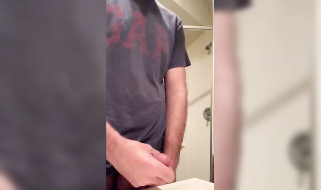 Insane frat fellow caught draining off in college bathroom