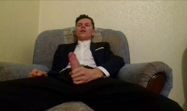 After working in the office, the guy masturbates off his spear and finishes up in an office suit