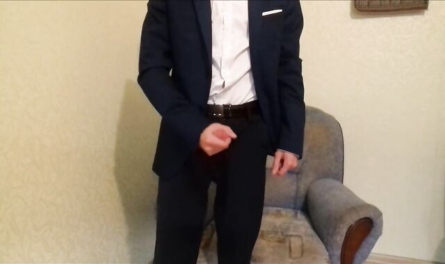 After working in the office, the guy masturbates off his spear and finishes up in an office suit