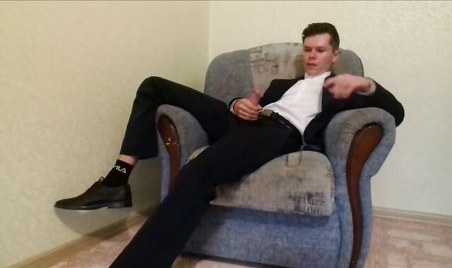 After working in the office, the guy masturbates off his spear and finishes up in an office suit