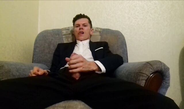 After working in the office, the guy masturbates off his spear and finishes up in an office suit
