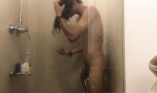 BEAUTIFUL LONG HAIRED DUDE DURING A SHOWER AND FONDLES TO SPURT HIS MILK