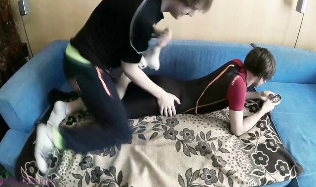 Wet lad in diving suit gets used by a nasty acquaintance, receives spunk-shot on his naked soles