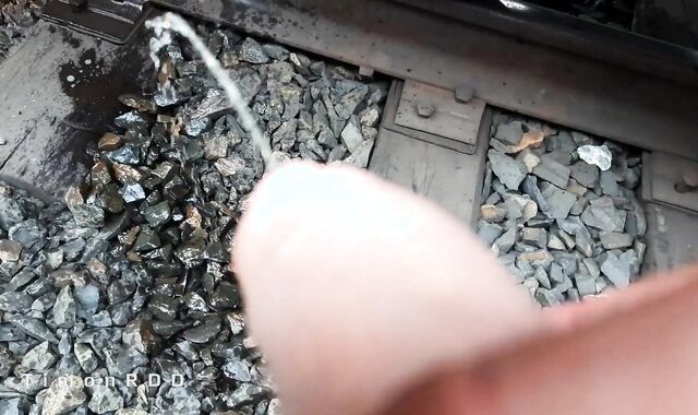 Railroad worker jacks and jizzes in a found love glove