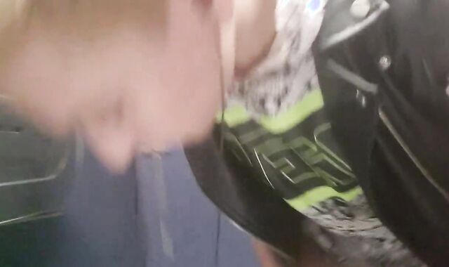 Stranger reaches under stall to grasp Daniel Hausser's trunk