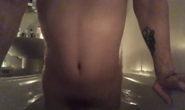 Young fellow takes a bath with candles and cum there