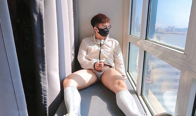 Cute teen strokes and completes off in the backside-shaft by the window