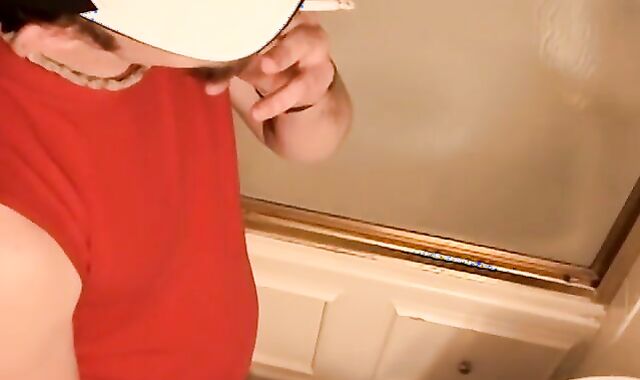 Perverted youthful boy plays with his instrument while smoking a cig