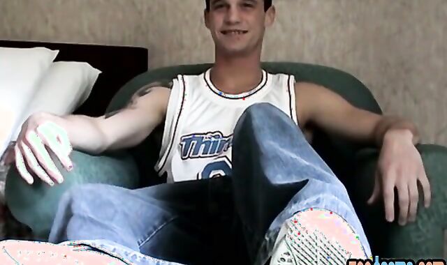 Abnormal lad displays his naked feet and tugs pecker solo