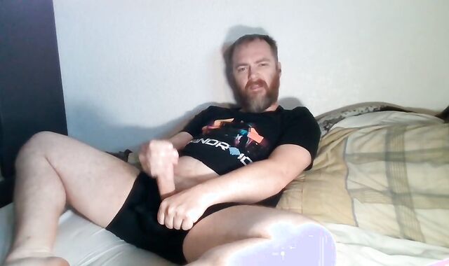 Scruffy fellow jerks off to porn, snuffles underwear, & eats his own geyser