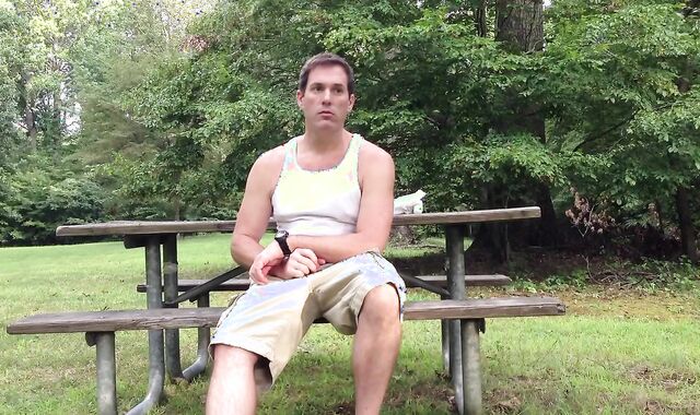 Milking in the public park next to the busy road.