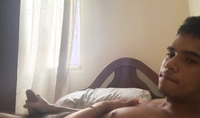 DARK-SKINNED MAN TOYING WITH HIS MAN MEAT