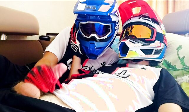two fellows in helmets jack off and jizz