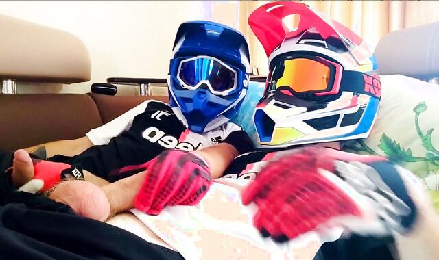 two fellows in helmets jack off and jizz