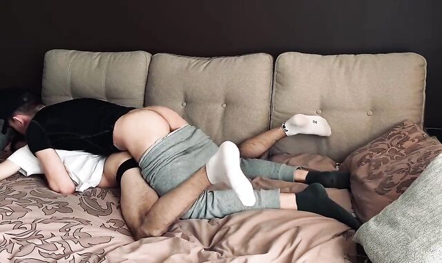 two boys have fun at bed