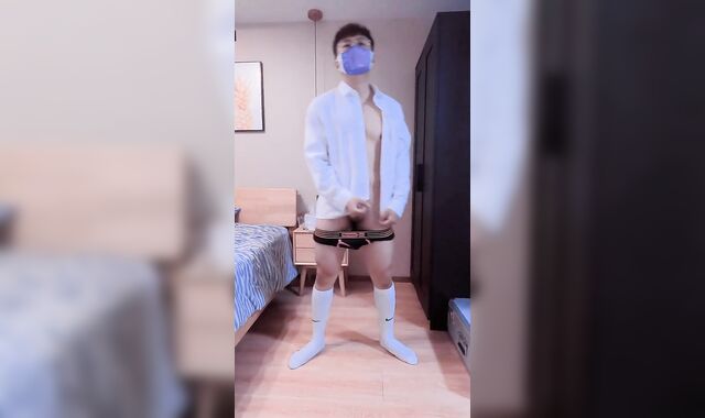 Boy in t-t-shirt jerks and shoots a geyser at home