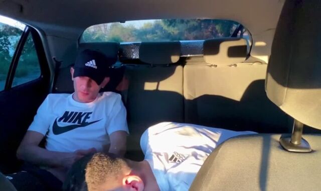 Homosexual fellating in camper outdoor