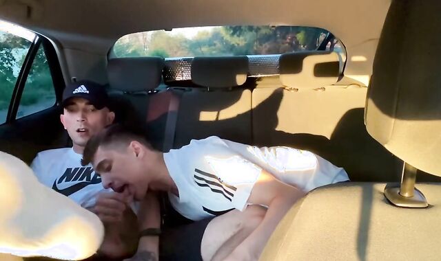 Homosexual fellating in camper outdoor