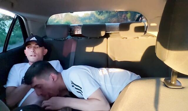 Homosexual fellating in camper outdoor