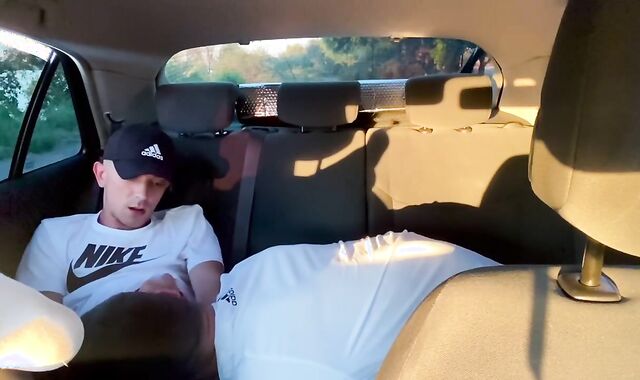 Homosexual fellating in camper outdoor