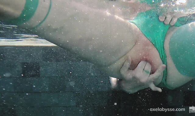 Axel Abysse fists his vagina by the pool