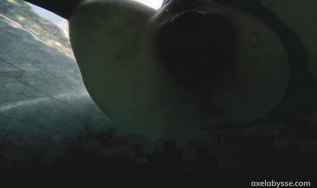 Axel Abysse fists his vagina by the pool