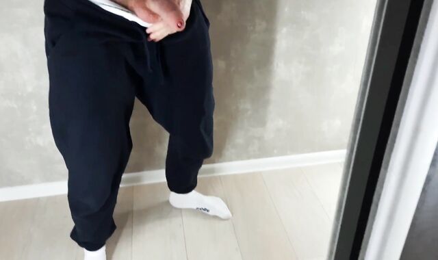 A guy in sweatpants cummed all over the mirror with fresh cum