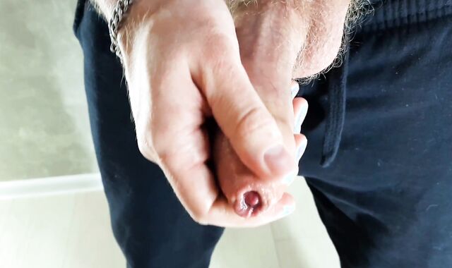 A guy in sweatpants cummed all over the mirror with fresh cum