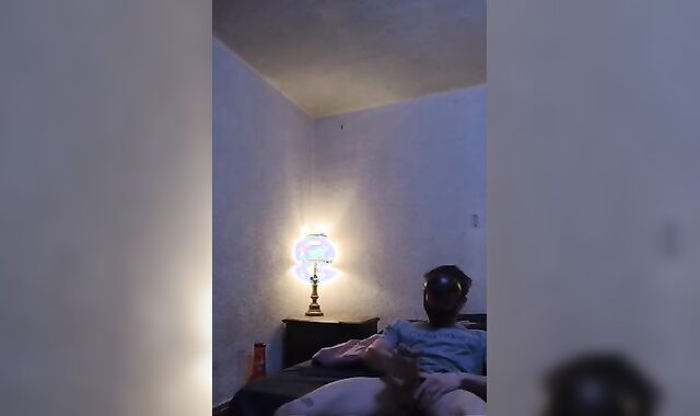 Strung Up lad urinates and strokes off!