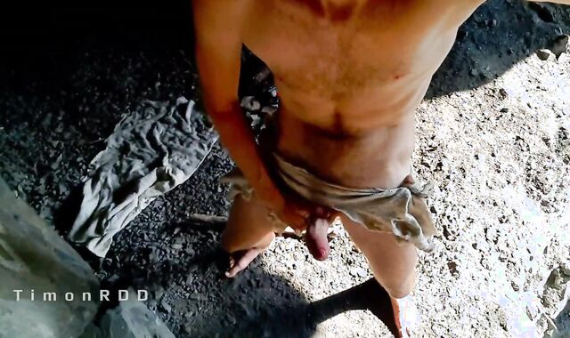 Neanderthal stud jacks hard-on in a tunnel near a campfire