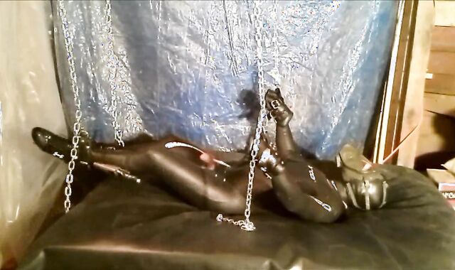 Shackled masked wetsuited Orca struggles to jerk off