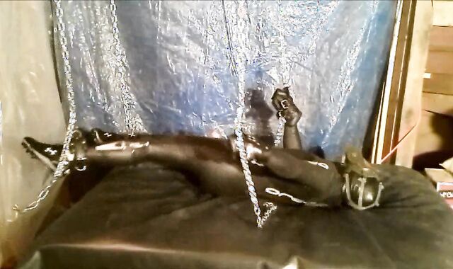 Shackled masked wetsuited Orca struggles to jerk off