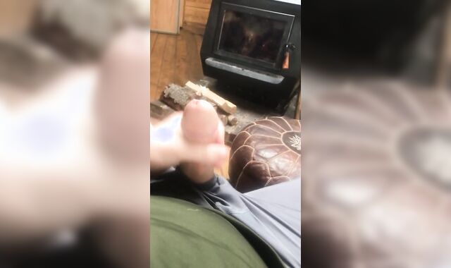 Crazy fellow alone in the wilderness chops weenie and rockets his cum by the fire